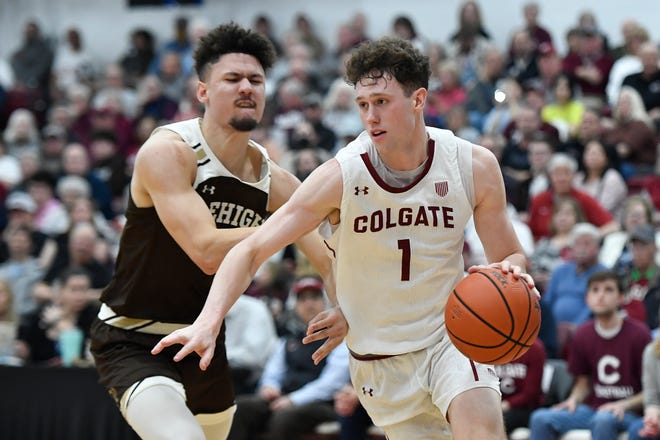 Colgate sophomore Brady Cummins, right, is defended by Lehigh guard Keith Higgins Jr. during the second half of Wednesday's Patriot League championship game. Cummins scored a career-high 19 points and Colgate secured a bid in next week's NCAA Men's Tournament with a 74-55 win.