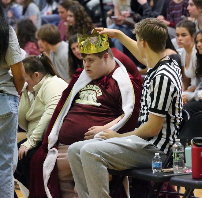 Teak Getman, president of the unified basketball club as well as today's ref places a crown on the head of Portsmouth Unified basketball player Niko Killinger durinng a game on March 15, 2024.