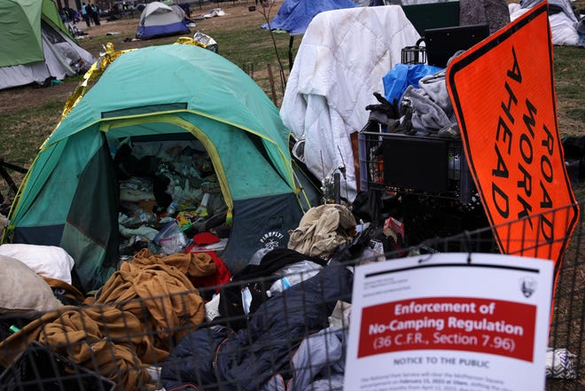 Belongings that occupants have left behind are seen as the National Park Service clear the homeless encampment at McPherson Square on Feb. 15, 2023 in Washington, DC. The National Park Service, under the request of the DC government, cleared the largest homeless encampment in the city that was once occupied by about 70 people.