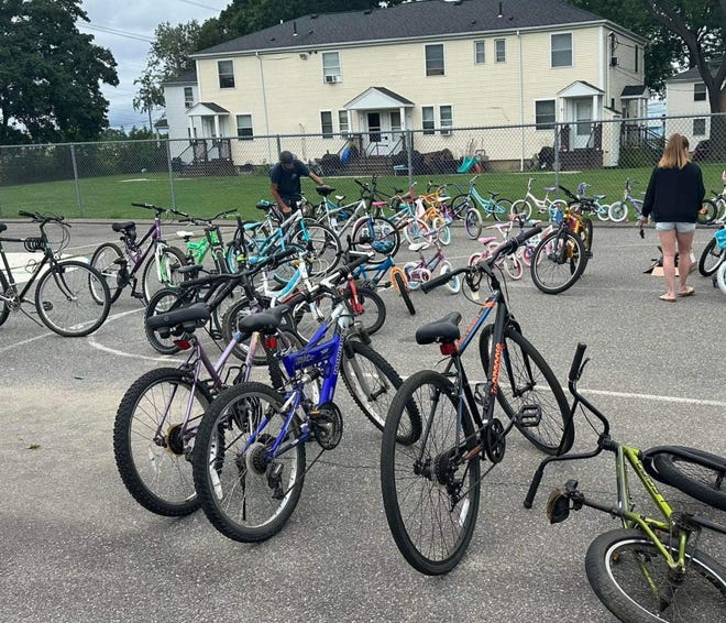 In late August 2023, a small group of volunteers distributed over 50 tuned-up and safety-checked bikes to kids living in PHA housing.